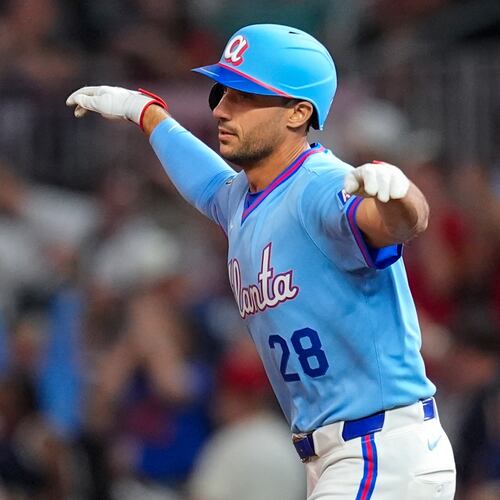 Atlanta Braves' Matt Olson (28) celebrates a two-run homer in the sixth inning of a baseball game against the Cleveland Guardians, Friday, April 10, 2026, in Atlanta. (AP Photo/Mike Stewart)