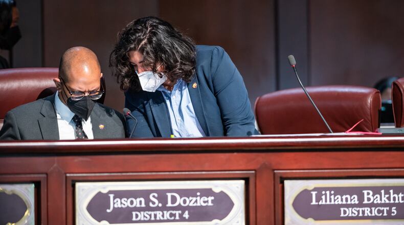 Atlanta City Councilmembers Jason Dozier (left) and Liliana Bakhtiari convene during the council's in-person meeting at City Hall on March 7, 2022. (Atlanta City Council Office of Communications)