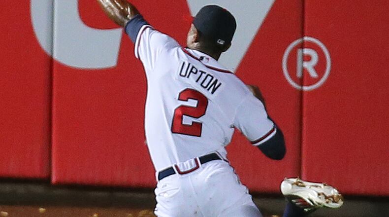 Braves outfielder Justin Upton fails to come up with ball that ended up a triple for Phillies Cole Hamels in the third inning in Monday's 5-1 loss to Philadelphia at Turner Field.
