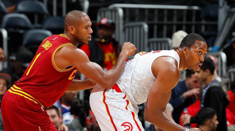 Dwight Howard (8) of the Hawks looks to drive against James Jones of the Cavaliers at Philips Arena on October 10, 2016 in Atlanta, Georgia. (Photo by Kevin C. Cox/Getty Images)