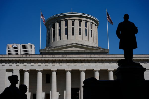 FILE - The William McKinley Monument is silhouetted in front of the west side of the Ohio Statehouse, April 15, 2024, in Columbus, Ohio. (AP Photo/Carolyn Kaster, File)
