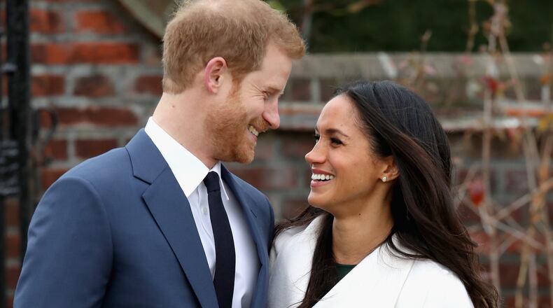 LONDON, ENGLAND - NOVEMBER 27: Prince Harry and Meghan Markle during an official photocall to announce the engagement of Prince Harry and actress Meghan Markle at The Sunken Gardens at Kensington Palace on November 27, 2017 in London, England. Prince Harry and Meghan Markle have been a couple officially since November 2016 and are due to marry in Spring 2018. (Photo by Chris Jackson/Getty Images)