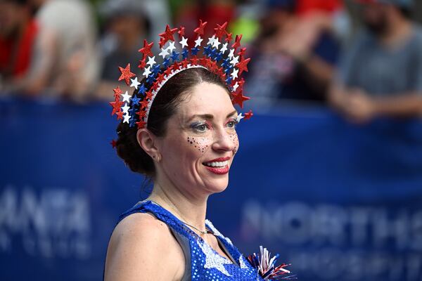 Many runners embraced a patriotic theme with their Peachtree costumes this year. (Hyosub Shin/AJC)