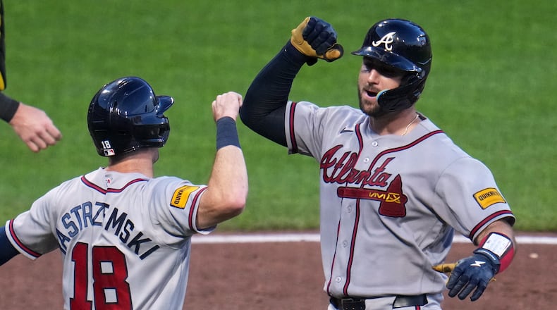 Atlanta Braves' Joey Bart, right, celebrates with Mike Yastrzemski as he returns to the dugout after hitting a two-run home run off Pittsburgh Pirates pitcher Dennis Santana during the eighth inning of a baseball game in Pittsburgh, Wednesday, July 8, 2026. (AP Photo/Gene J. Puskar)