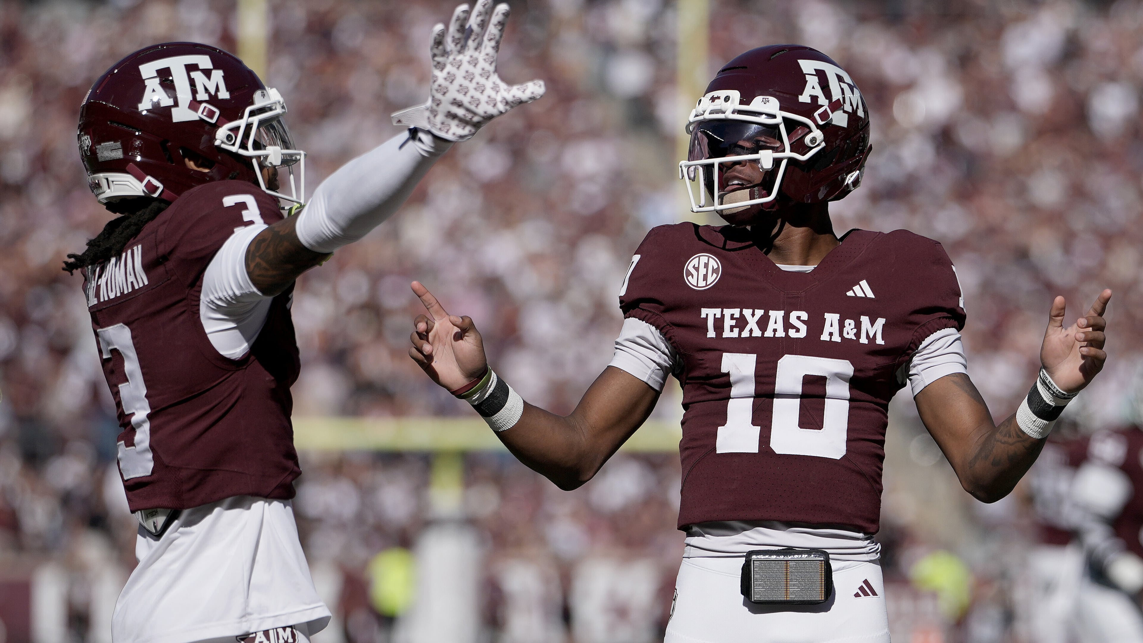 Texas A&M wide receiver Ashton Bethel-Roman (3) reacts with quarterback Marcel Reed (10) after scoring a touchdown agianst Samford during the first quarter of an NCAA college football game Saturday, Nov. 22, 2025, in College Station, Texas. (AP Photo/Sam Craft)