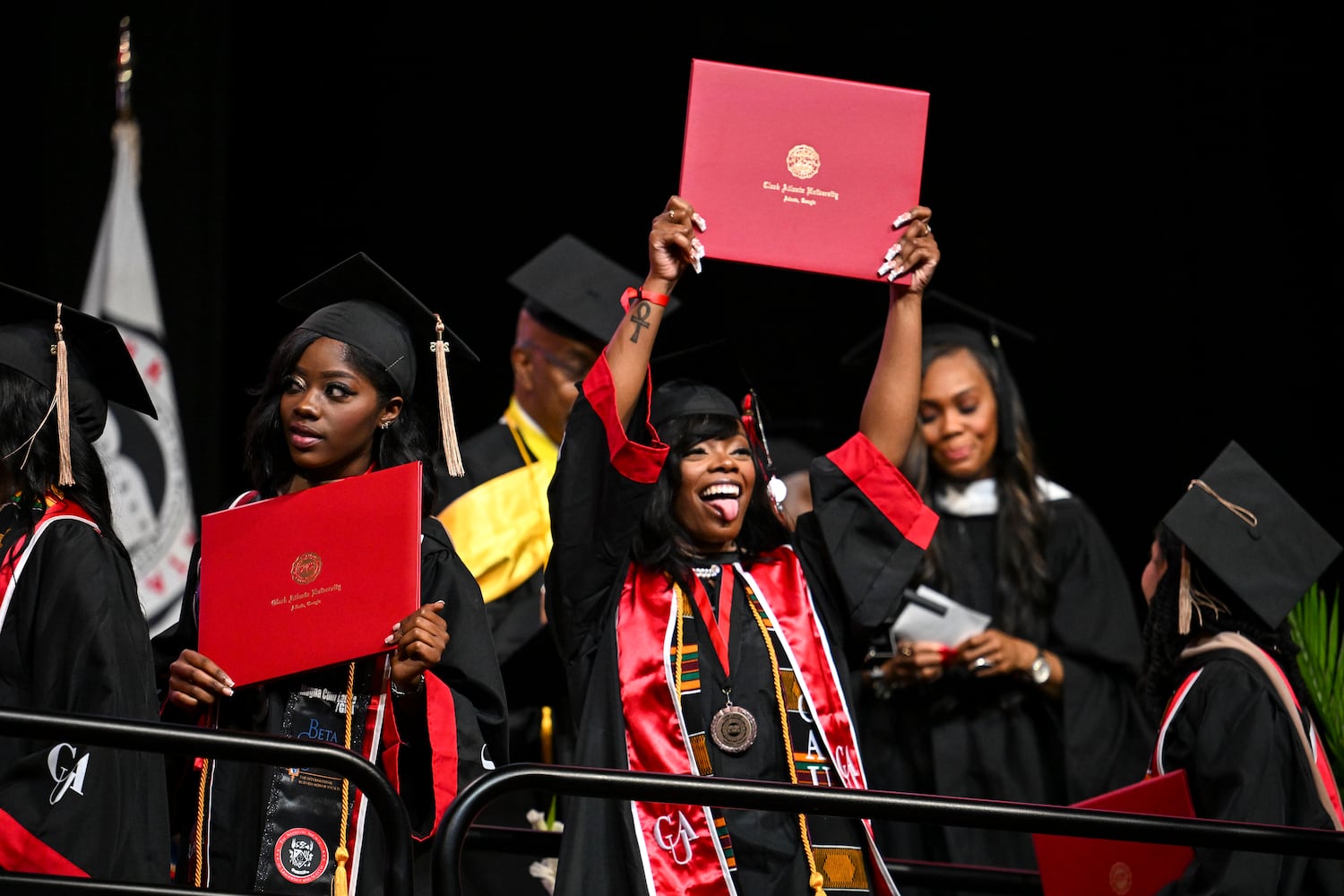 Jayla Howell celebrates while walking across the stage during Clark Atlanta University’s 2025 commencement ceremony Sunday, May 18, 2025 at Georgia State’s Convocation Center. (Daniel Varnado/For the Atlanta Journal-Constitution)