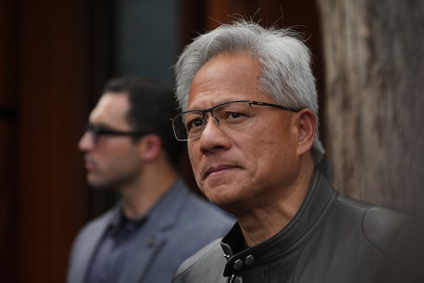 CEO of Nvidia Jensen Huang pauses during a press conference at the Mandarin Oriental Qianmen after attending the third China International Supply Chain Expo, in Beijing, Wednesday, July 16, 2025. (AP Photo/Andy Wong)