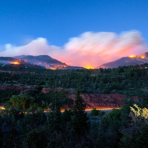 Firefighters drive along Highway 550 as they try to access the Gold Mountain Fire on the town line of Ouray and Ridgeway, Colo., on Sunday, June 28, 2026. (Michael Seamans/The Gazette via AP)