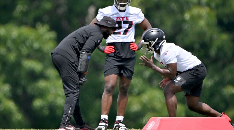 Atlanta Falcons edge rusher Jalon Walker (11) runs a drill as James Pearce Jr. (27) looks during the Atlanta Falcons Rookie Minicamp at the Atlanta Falcons Training Camp, Friday, May 9, 2025, in Flowery Branch. (Hyosub Shin/AJC)