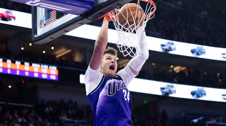 Utah Jazz center Walker Kessler (24) dunks during the second half of an NBA basketball game, Monday, Oct. 27, 2025, in Salt Lake City. (AP Photo/Anna Fuder)