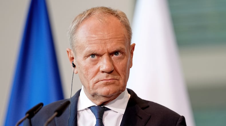FILE - Polish Prime Minister Donald Tusk looks on during a press conference during the E5 summit of leading European nations ahead of the upcoming NATO summit, in Berlin, Wednesday June 24, 2026. (Kay Nietfeld/dpa via AP,File)