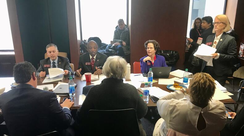 From left, state representatives Matthew Wilson, Billy Mitchell, Becky Evans and Karla Drenner (standing) during a Wednesday, Feb. 19, meeting of the DeKalb County House delegation. TYLER ESTEP / TYLER.ESTEP@AJC.COM