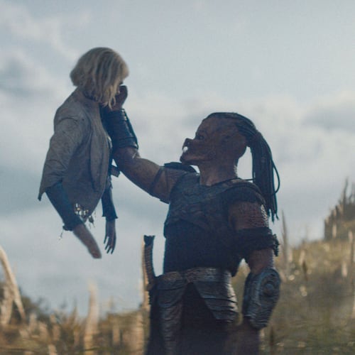 This image released by 20th Century Studios shows Thia, portrayed by Elle Fanning, left, and Dek, portrayed by Dimitrius Schuster-Koloamatangi, in a scene from "Predator: Badlands." (20th Century Studios/Disney via AP)