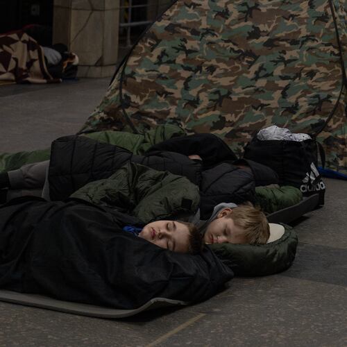 People take shelter in a metro station, being used as a bomb shelter, during a Russian drones attack in Kyiv, Ukraine, Tuesday, Feb. 3, 2026. (AP Photo/Alex Babenko)