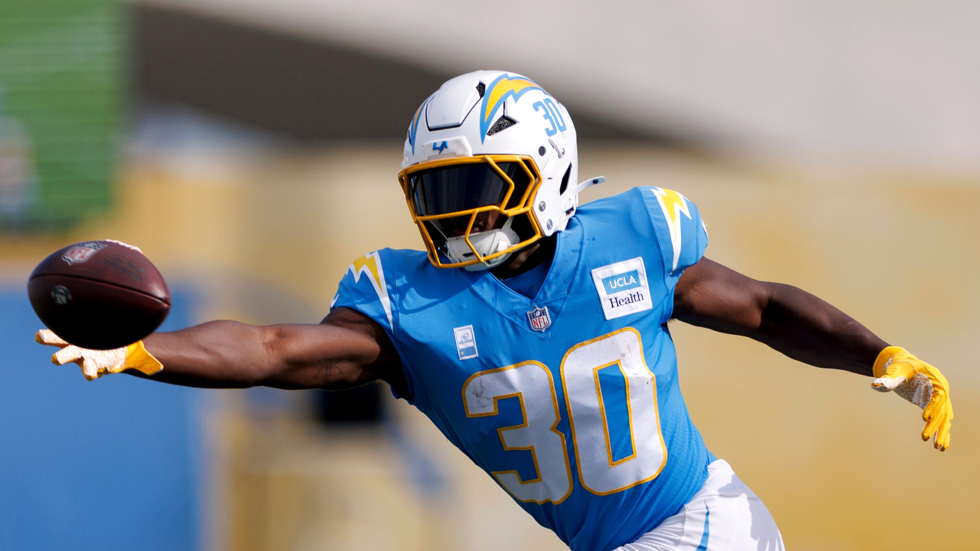 Los Angeles Chargers running back Kimani Vidal reaches for a pass during an NFL football training camp Saturday, July 26, 2025, in El Segundo, Calif. (AP Photo/Eric Thayer)