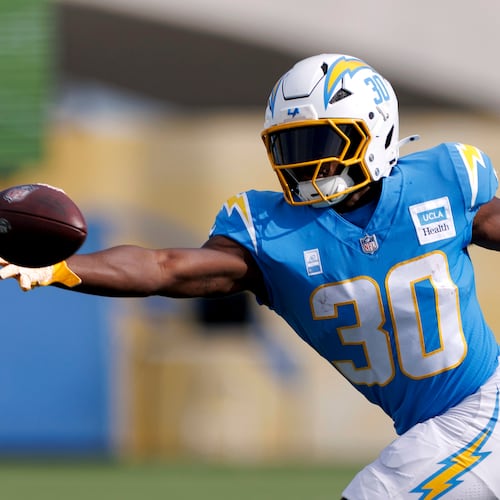 Los Angeles Chargers running back Kimani Vidal reaches for a pass during an NFL football training camp Saturday, July 26, 2025, in El Segundo, Calif. (AP Photo/Eric Thayer)