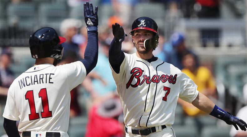 Atlanta Braves Dansby Swanson gets five from Ender Inciarte hitting a solo home run to tie the game 2-2 during the seventh inning against the Washington Nationals in a MLB baseball game on Sunday, June 3, 2018, in Atlanta.  Curtis Compton/ccompton@ajc.com
