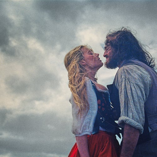 This image released by Warner Bros. Pictures shows Margot Robbie, left, and Jacob Elordi in a scene from "Wuthering Heights." (Warner Bros. Pictures via AP)