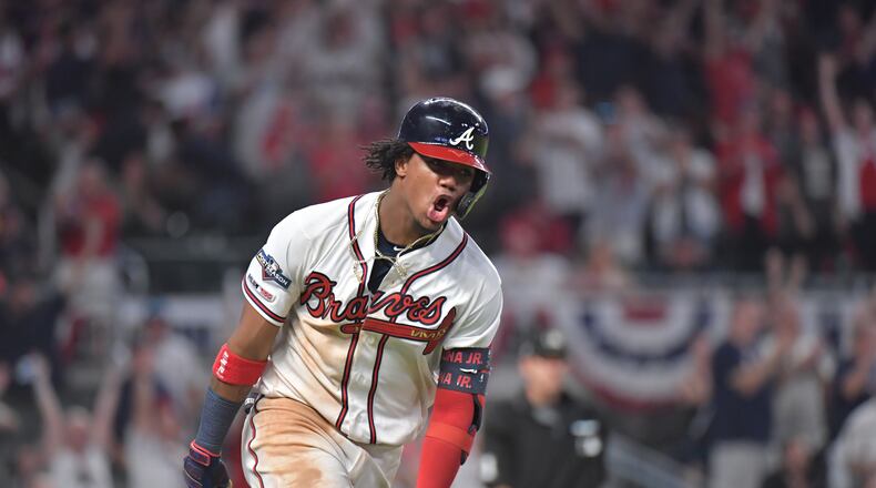 Braves center fielder Ronald Acuna Jr.  hits a home run  during Game 1 of  the National League Division Series at SunTrust Park on Thursday, October 3, 2019. (Hyosub Shin / Hyosub.Shin@ajc.com)
