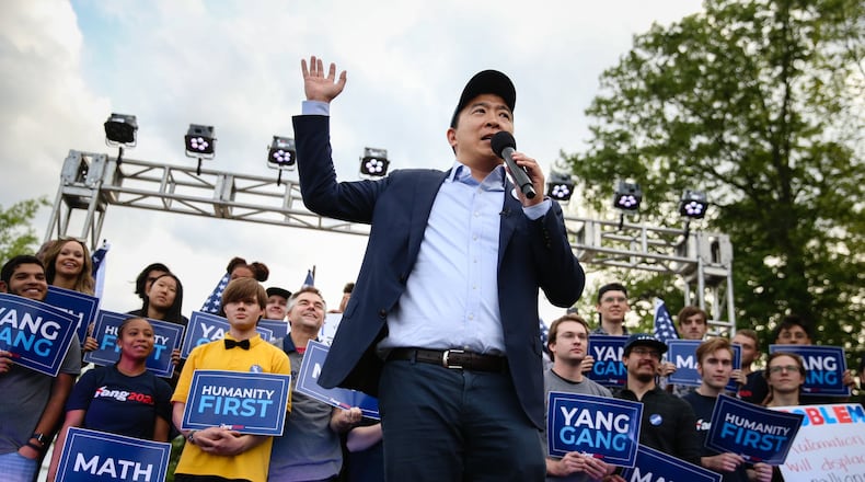 Andrew Yang, who’s seeking the 2020 Democratic presidential nomination, speaks Thursday at a campaign event in Piedmont Park in Atlanta. He offered a warning about automation’s potential impact as a threat to the workplace. He made a pitch for universal basic income as a remedy. The policy calls for giving $1,000 per month to each American over age 18.