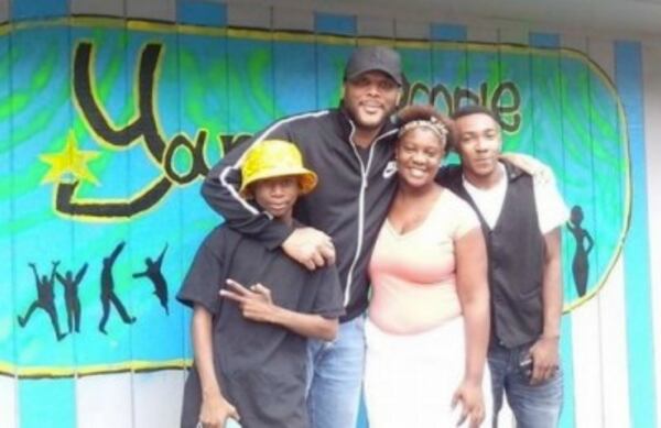Tyler Perry with kids at Young People Matter