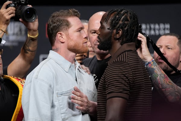 Canelo Alvarez, left, and Terence Crawford face off during a news conference for their upcoming boxing match Friday, June 27, 2025, in Las Vegas. (AP Photo/John Locher)