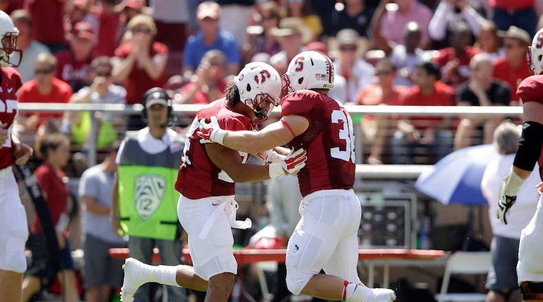 PALO ALTO, CA - SEPTEMBER 06: Patrick Skov #24 of the Stanford Cardinal is congratulated by Lee Ward #36 after he scored a touchdown against the USC Trojans at Stanford Stadium on September 6, 2014 in Palo Alto, California. (Photo by Ezra Shaw/Getty Images) Former Stanford fullback Patrick Skov was a short-yardage specialist for the Cardinal. (GETTY IMAGES)