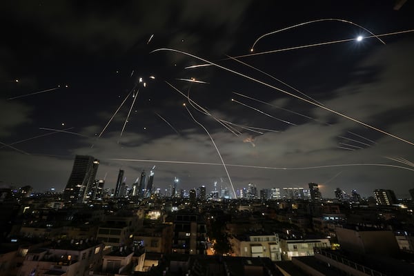 The Israeli Iron Dome air defense system fires to intercept missiles during an Iranian attack over Tel Aviv, Israel, Sunday, June 15, 2025. (AP Photo/Leo Correa)