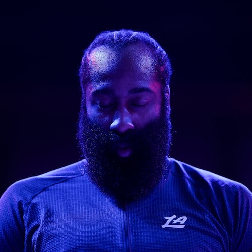Los Angeles Clippers guard James Harden (1) stands during the national anthem before an NBA basketball game against the Minnesota Timberwolves Saturday, Dec. 6, 2025, in Minneapolis. (AP Photo/Matt Krohn)