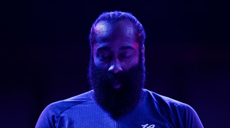 Los Angeles Clippers guard James Harden (1) stands during the national anthem before an NBA basketball game against the Minnesota Timberwolves Saturday, Dec. 6, 2025, in Minneapolis. (AP Photo/Matt Krohn)