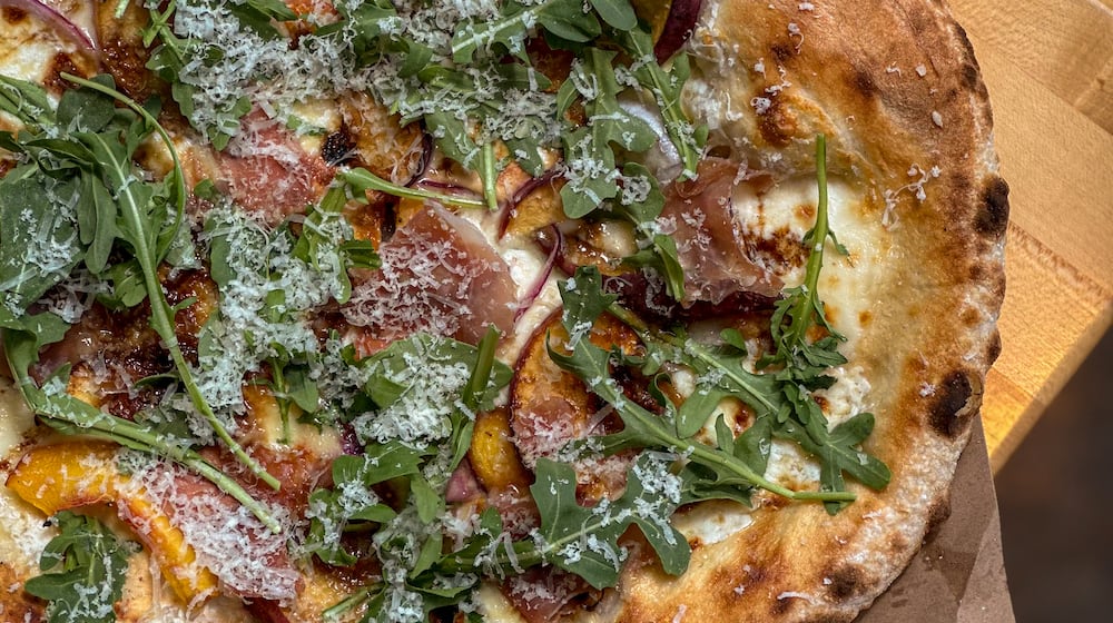 Peach pizza at Indaco is just one of four dishes to try in August. (Courtesy of Vicki Artorntamarat)