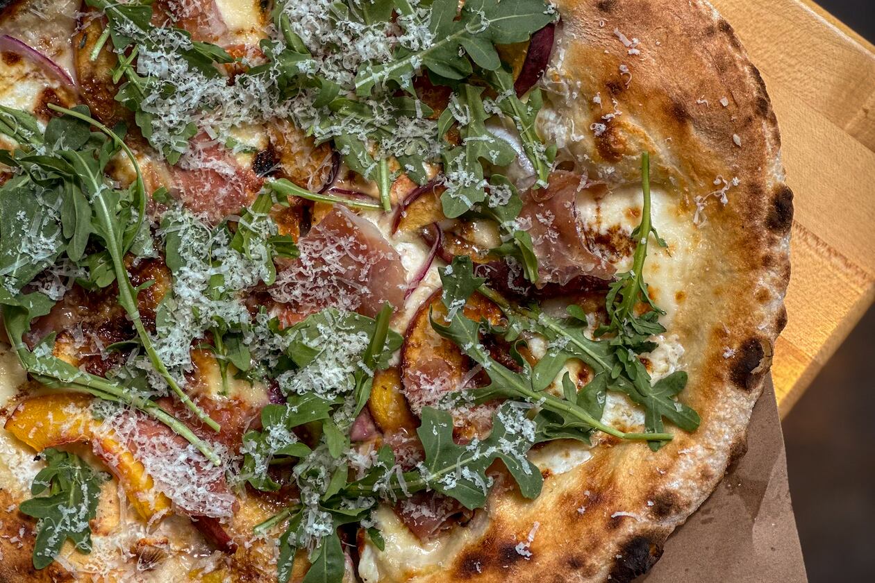 Peach pizza at Indaco is just one of four dishes to try in August. (Courtesy of Vicki Artorntamarat)