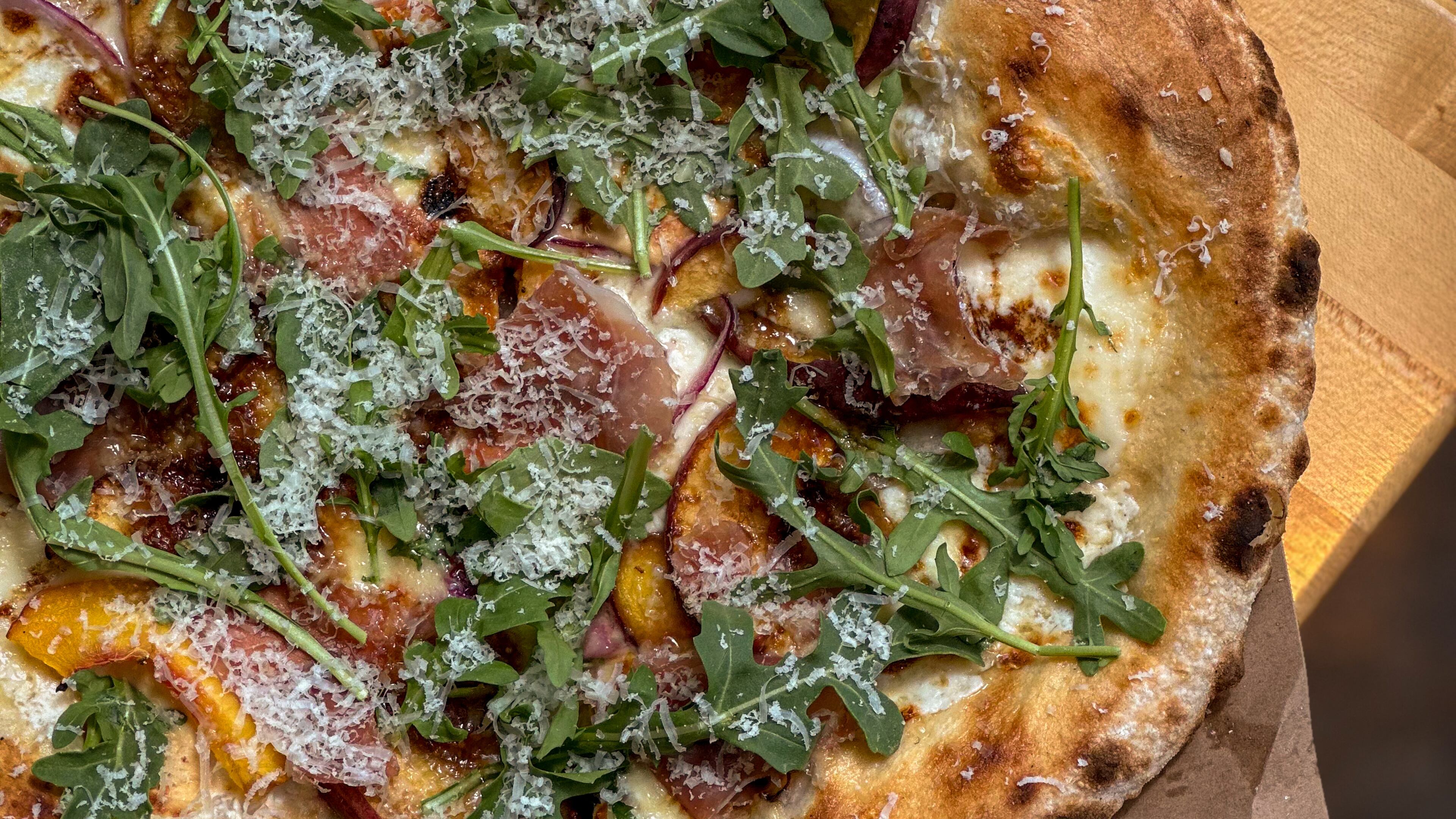 Peach pizza at Indaco is just one of four dishes to try in August. (Courtesy of Vicki Artorntamarat)