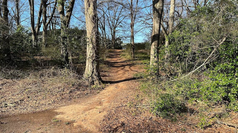 Photo shows a path behind murder suspect Jose Antonio Ibarra's Cielo Azulyk apartment complex on South Milledge Avenue in Athens, Georgia on Saturday Feb. 24, 2024. The path leads to trails where nursing student Laken Hope Riley was found dead Feb. 22 in a wooded area near the University of Georgia's intramural fields.