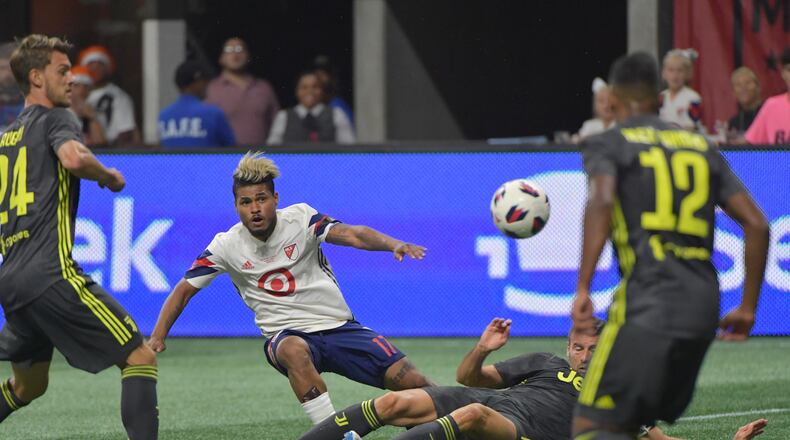 August 1, 2018 Atlanta -  MLS All-Stars forward Josef Martinez (17) gets tackled by Juventus defender Andrea Barzagli (15) in the first half of the Major League Soccer All-Star Game at the Mercedes-Benz Stadium on Wednesday, August 1, 2018. HYOSUB SHIN / HSHIN@AJC.COM