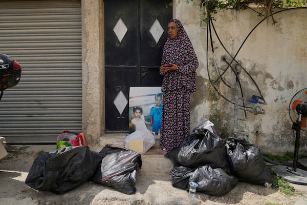 Residents of the now evacuated refugee camp of Tulkarem return to collect belongings before the destruction of their homes as Israeli forces prepare to carry out the demolition of 116 homes across the two refugee camps of the Israeli occupied West Bank city of Tulkarem, Friday, May 2, 2025. (AP Photo/Nasser Nasser)