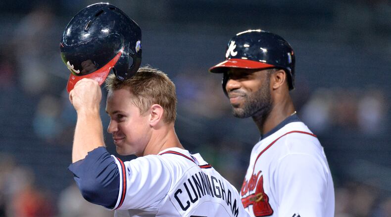 Todd Cunningham celebrates after hitting a single on his MLB debut in the 7th inning against the Colorado Rockies at Turner Field in Atlanta on Tuesday, July 30, 2013. After Reed Johnson tweaked his Achilles tendon on Sunday, the Braves made a roster move late Monday night to help bolster their bench.