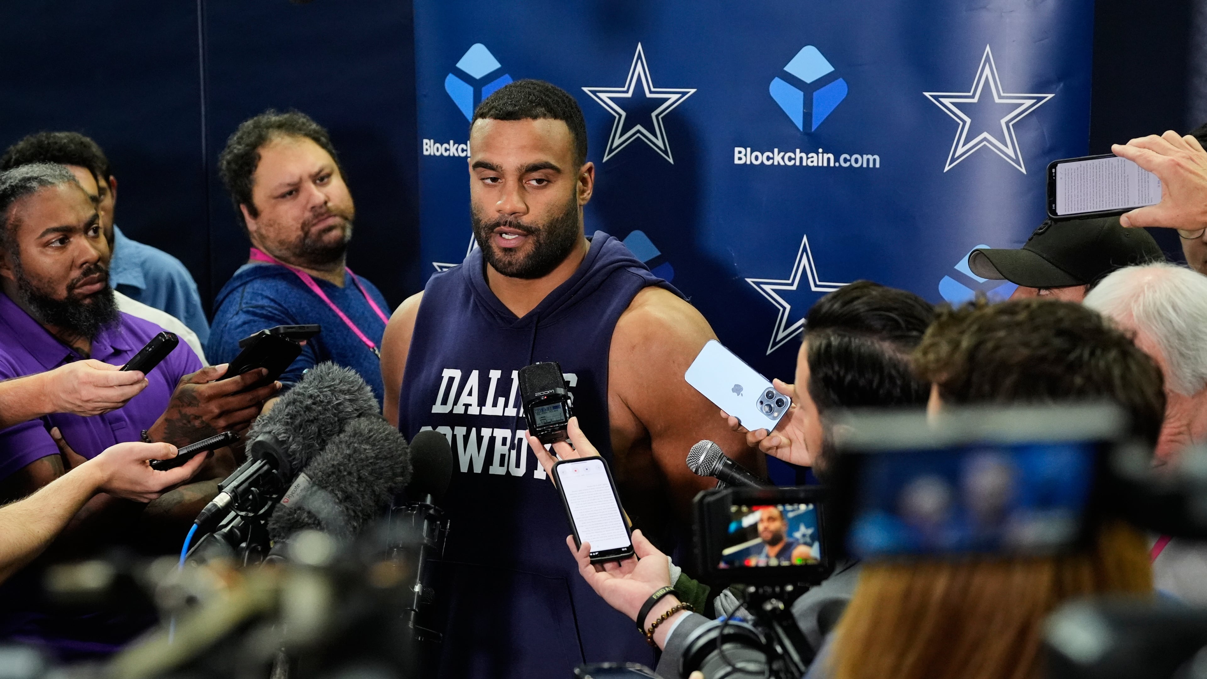 CORRECTS TO THURSDAY, NOV. 13 NOT FRIDAY, NOV. 14 - Dallas Cowboys' Solomon Thomas, center, responds to a question during a news conference after an NFL football practice at the team's headquarters Thursday, Nov. 13, 2025, in Frisco, Texas. (AP Photo/Tony Gutierrez)