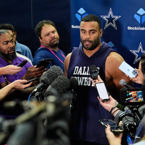 CORRECTS TO THURSDAY, NOV. 13 NOT FRIDAY, NOV. 14 - Dallas Cowboys' Solomon Thomas, center, responds to a question during a news conference after an NFL football practice at the team's headquarters Thursday, Nov. 13, 2025, in Frisco, Texas. (AP Photo/Tony Gutierrez)