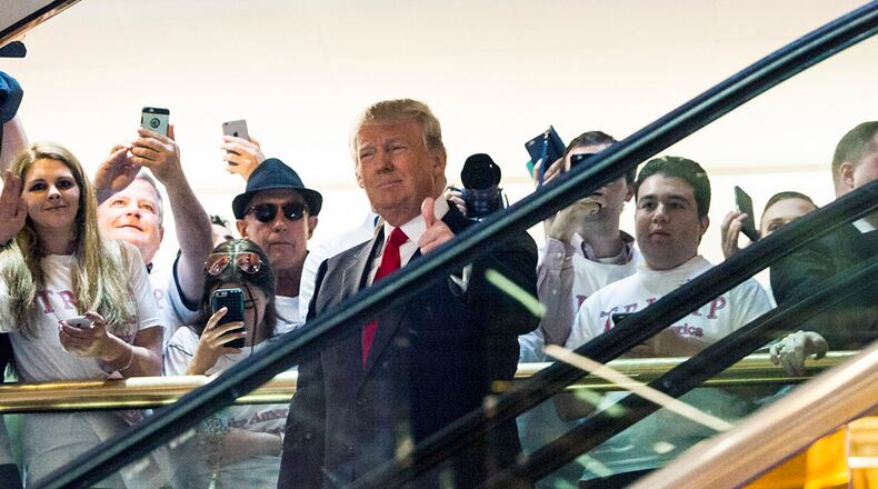 NEW YORK, NY - JUNE 16: Business mogul Donald Trump rides an escalator to a press event to announce his candidacy for the U.S. presidency at Trump Tower on June 16, 2015 in New York City. Trump is the 12th Republican who has announced running for the White House. (Photo by Christopher Gregory/Getty Images)