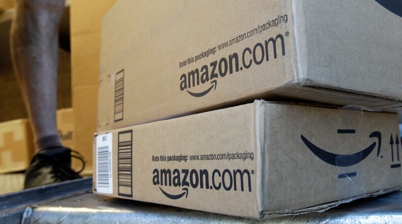 In this June 30, 2011 file photo, a United Parcel Service driver delivers packages from Amazon.com in Palo Alto, Calif. Amazon aimed for Christmas in July with its much-hyped "Prime Day" sale on Wednesday, July 15, 2015, but some shoppers were disappointed by the offerings. (Paul Sakuma / Associated Press)