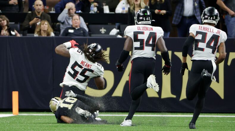 Atlanta Falcons linebacker Steven Means (55) is tackled by New Orleans Saints wide receiver Tre'Quan Smith (10) after a fumble during the second half of an NFL football game, Sunday, Nov. 7, 2021, in New Orleans. (AP Photo/Derick Hingle)