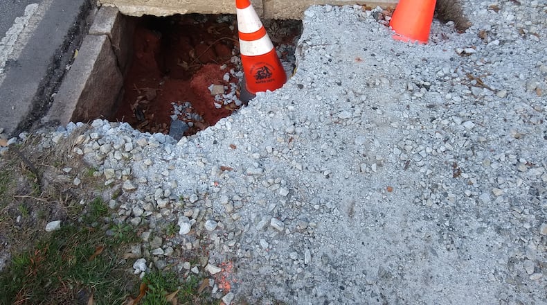 Bill Woolf sent us this pic of the recent DOT fix at a sidewalk in Decatur. (Photo/Bill Woolf).