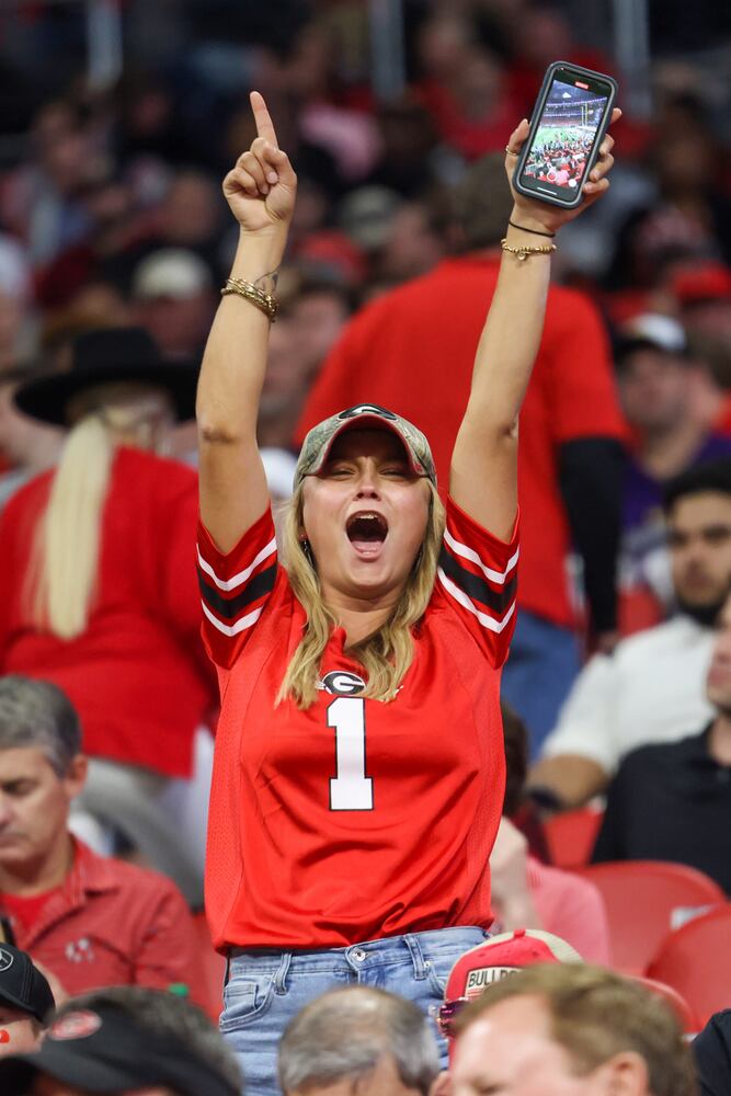 A Georgia Bulldog fan gets ready for action during the SEC Championship Game at Mercedes-Benz Stadium in Atlanta on Saturday, Dec. 3, 2022. (Jason Getz / Jason.Getz@ajc.com)