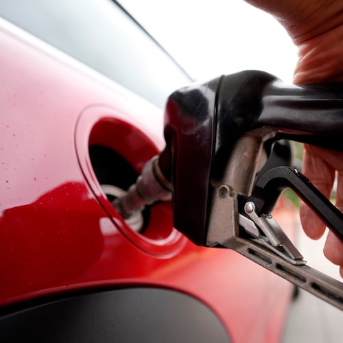FILE - A motorist pumps fuel at a Shell station Wednesday, July 5, 2023, in Englewood, Colo. (AP Photo/David Zalubowski, File)