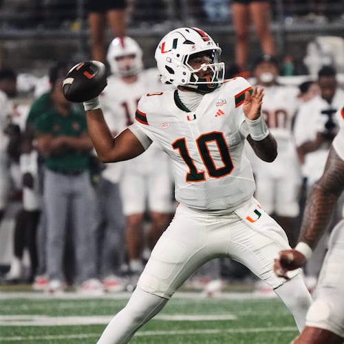 Miami quarterback Darian Mensah (10) looks to pass the ball against Wake Forest during the first half of an NCAA college football game in Winston-Salem, N.C., Friday, Sept. 18, 2026. (AP Photo/Chuck Burton)