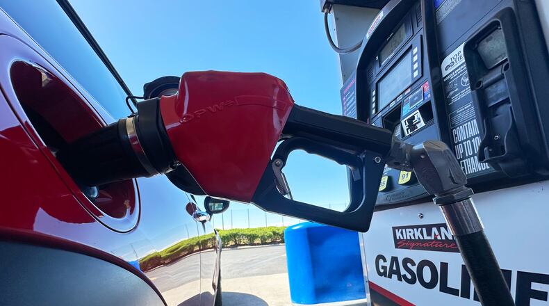 FILE - A motorist fills up the tank of a vehicle at a Costco gasoline station Wednesday, April 15, 2026, in Sheridan, Colo. (AP Photo/David Zalubowski, file)
