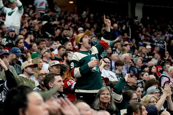 A Minnesota Wild fan reacts during the third period of an NHL hockey game against the New Jersey Devils, Monday, March 31, 2025, in Newark, N.J. (AP Photo/Julia Demaree Nikhinson)