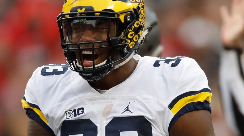COLUMBUS, OH - NOVEMBER 26: Taco Charlton #33 of the Michigan Wolverines celebrates after a sack during the fourth quarter against the Ohio State Buckeyes at Ohio Stadium on November 26, 2016 in Columbus, Ohio. (Photo by Gregory Shamus/Getty Images)