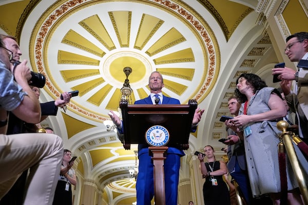 Sen. Majority Leader John Thune, R-S.D., center, talks after a policy luncheon on Wednesday, July 9, 2025, at the Capitol in Washington. (AP Photo/Mariam Zuhaib)